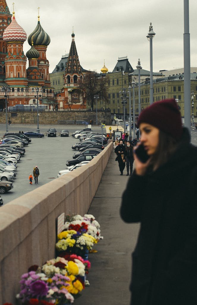 Blurred foreground street scene with St. Basil's Cathedral in Moscow in the background.